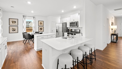 Kitchen with island with granite counter tops.