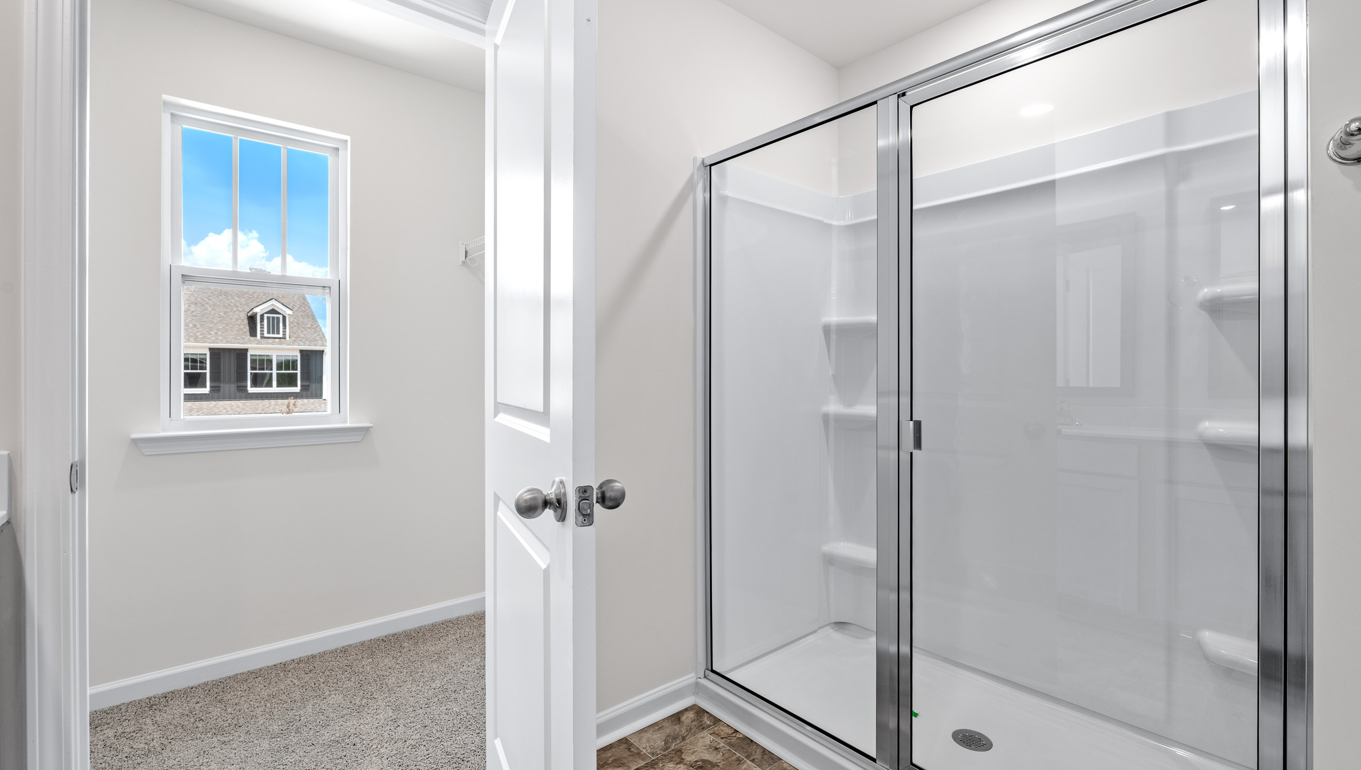 Bathroom with walk in shower.