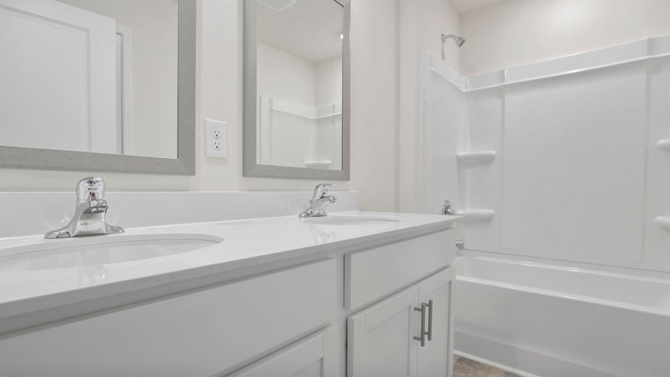 Bathroom with vanity and tub.