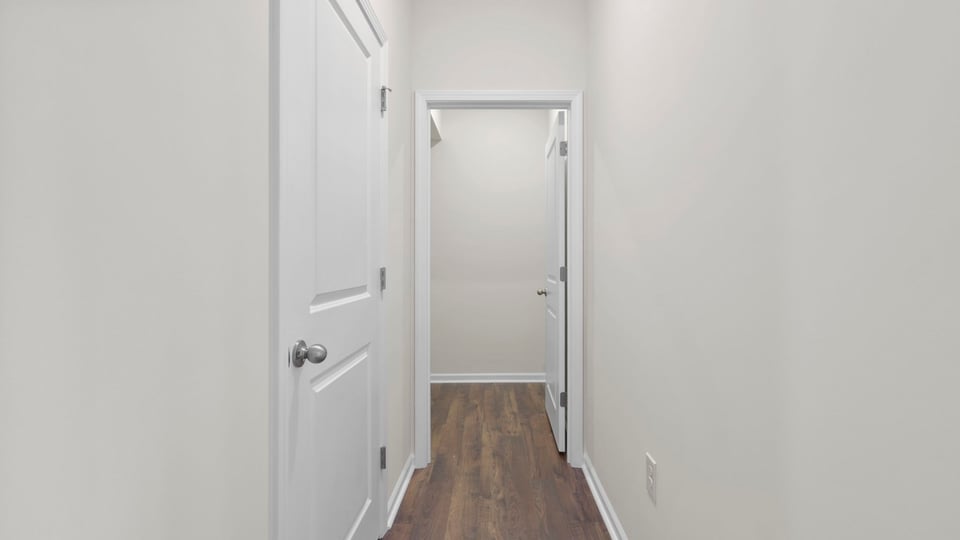 Bedroom with carpet and window.