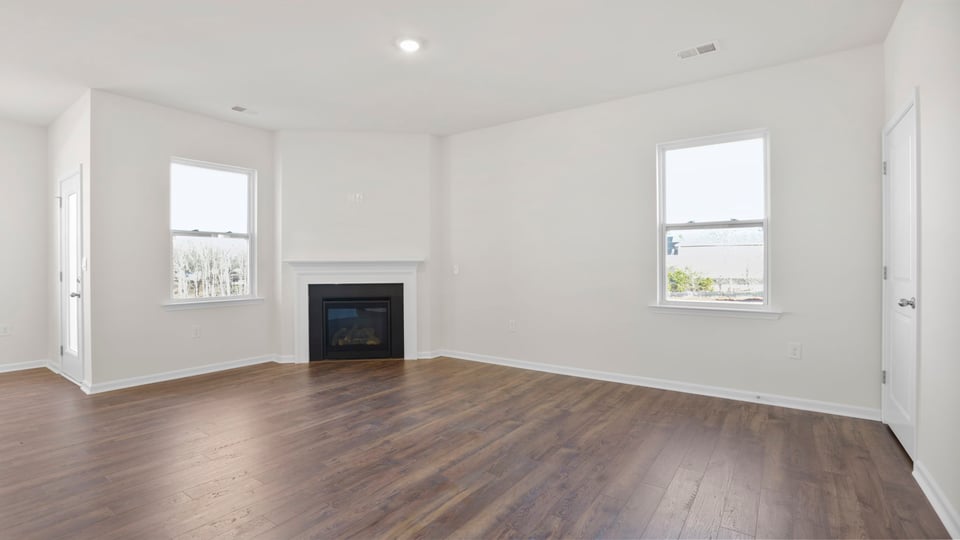 Bedroom with carpet and window.