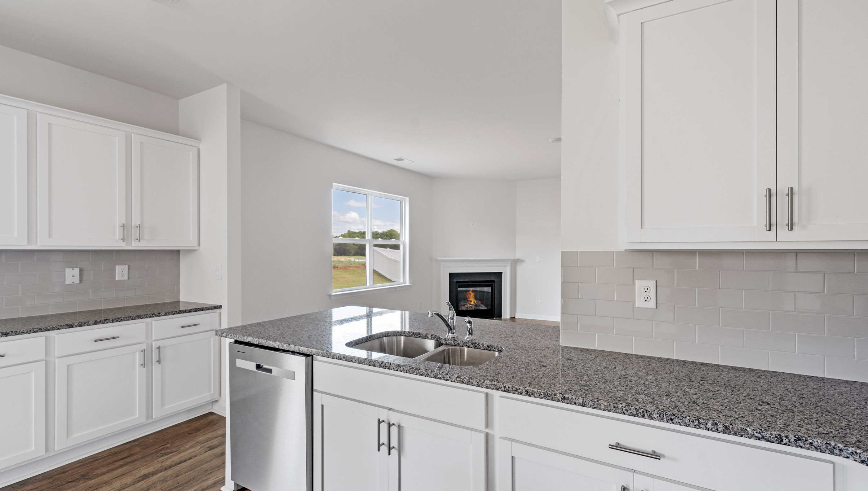 Kitchen with granite countertops and stainless steel appliances.