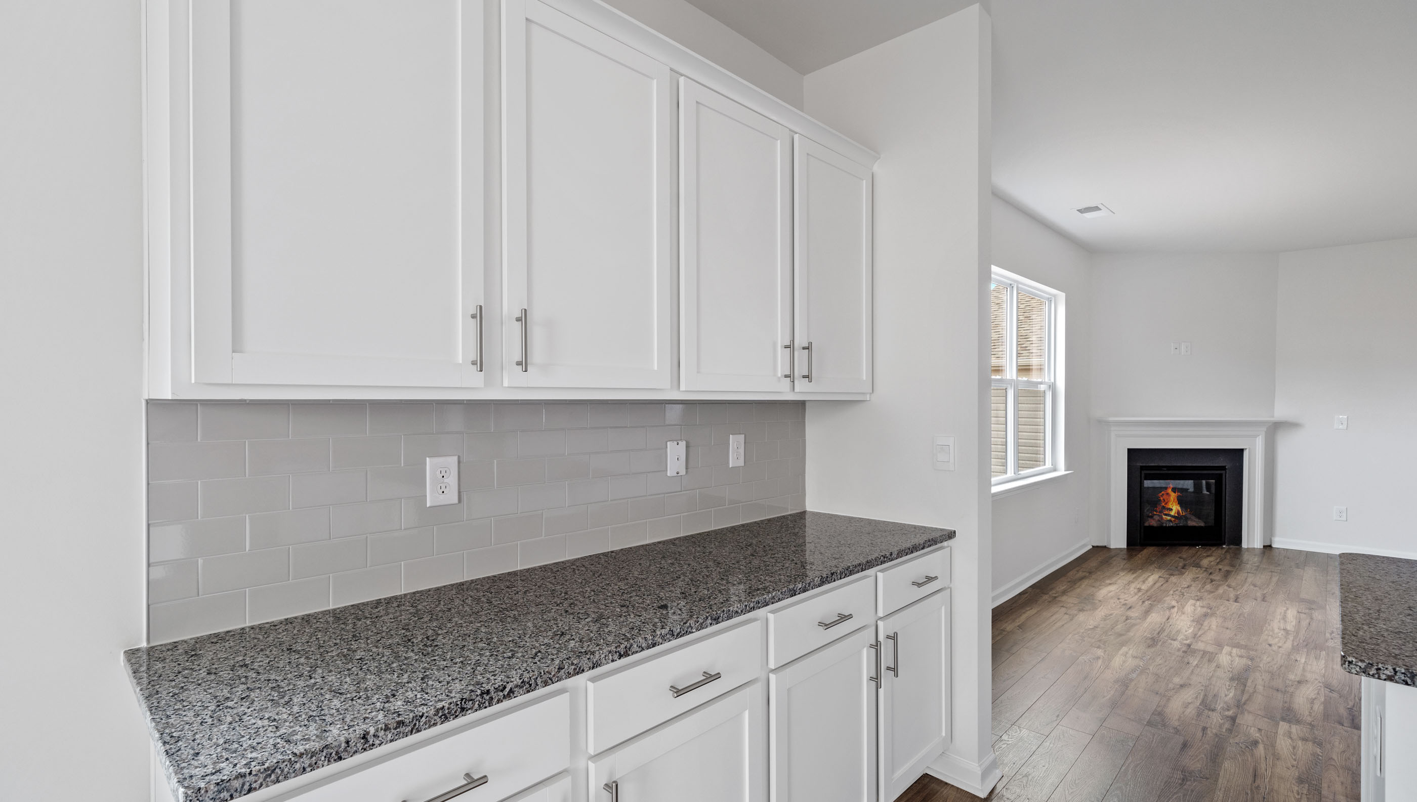 Kitchen with granite countertops and stainless steel appliances.