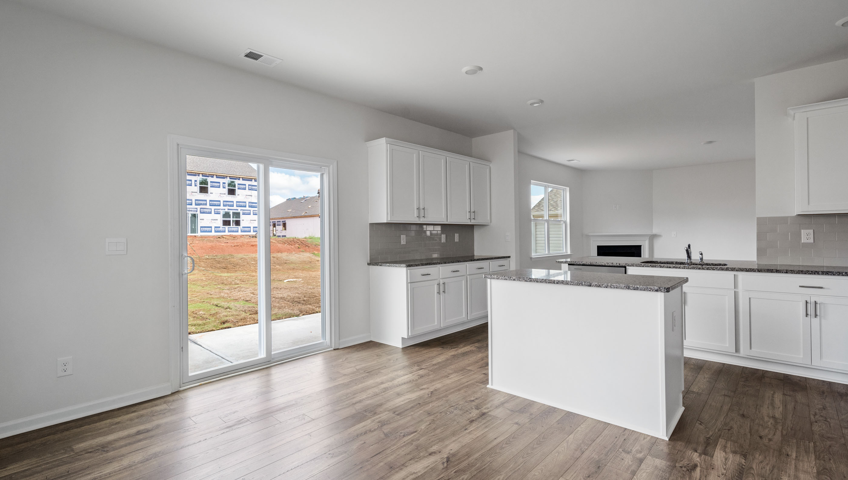 Kitchen with granite countertops and stainless steel appliances.