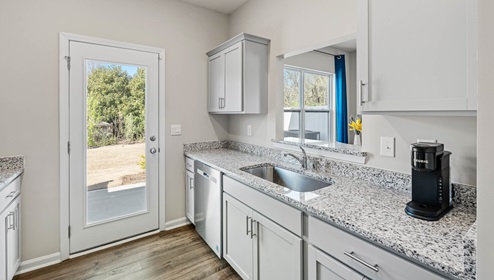 Kitchen with granite counter tops.