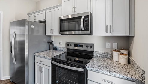 Kitchen with granite counter tops.