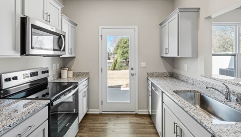 Kitchen with granite counter tops.