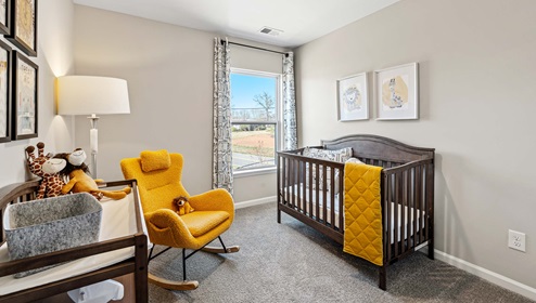 Bedroom one with carpet and window.