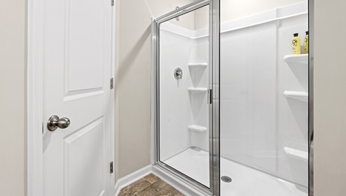 Walk in shower in primary bathroom.
