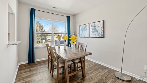 Dining room area with view of window.