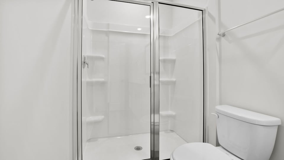 Bathroom with double vanity and shower.