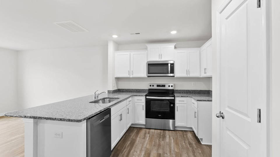 Kitchen with granite countertops.
