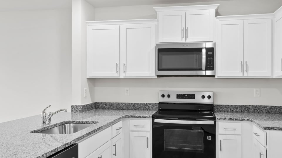 Kitchen with granite countertops.