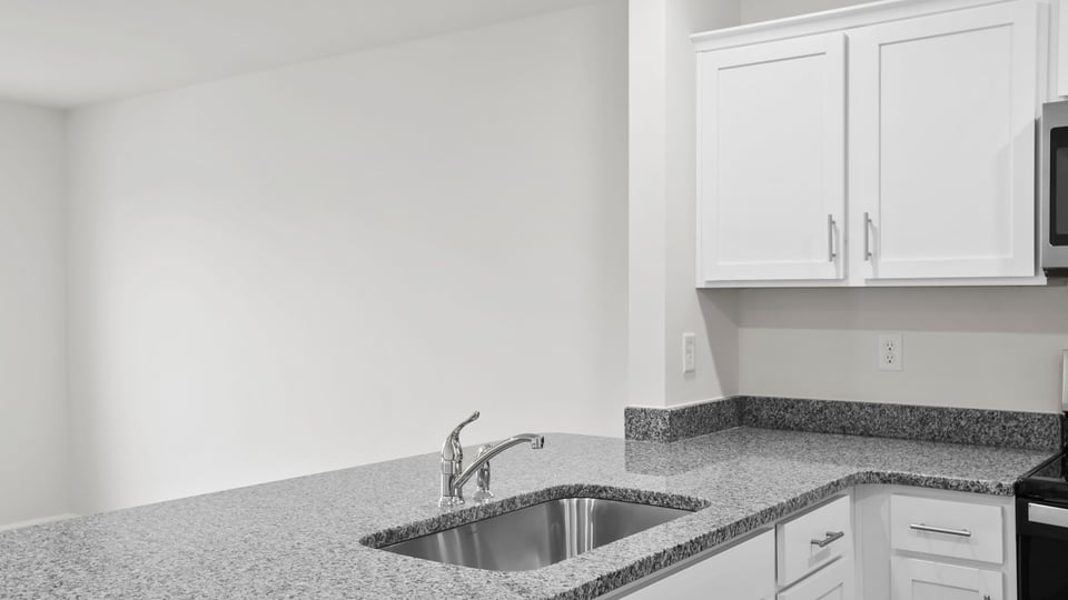 Kitchen with granite countertops.