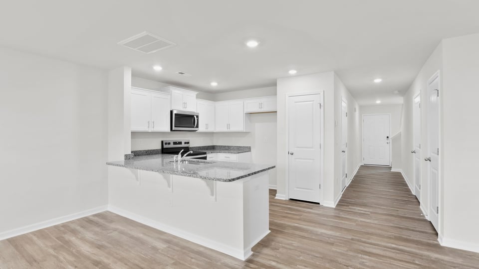 Kitchen with granite countertops.