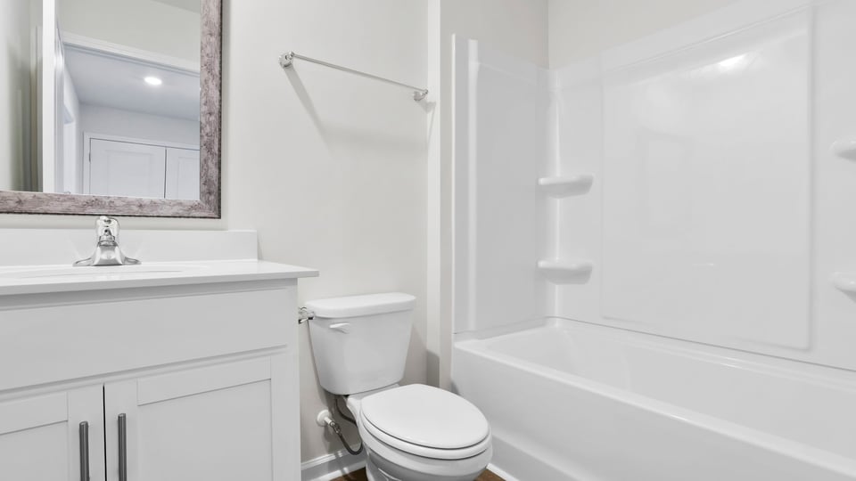 Bathroom with vanity and tub.