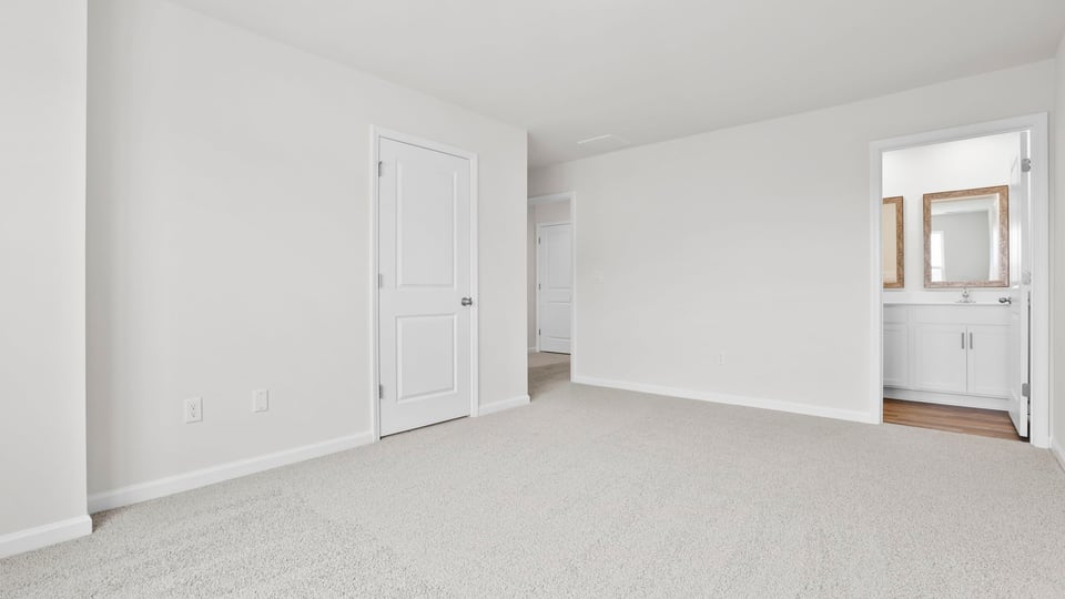 Bedroom with carpet.