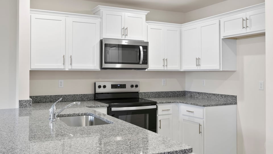 Kitchen with granite countertops.