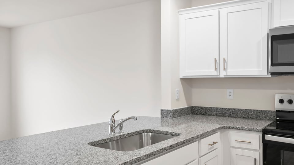 Kitchen with granite countertops.