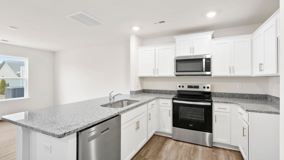 Kitchen with granite countertops.