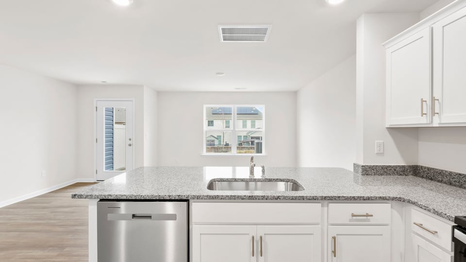 Kitchen with granite countertops.