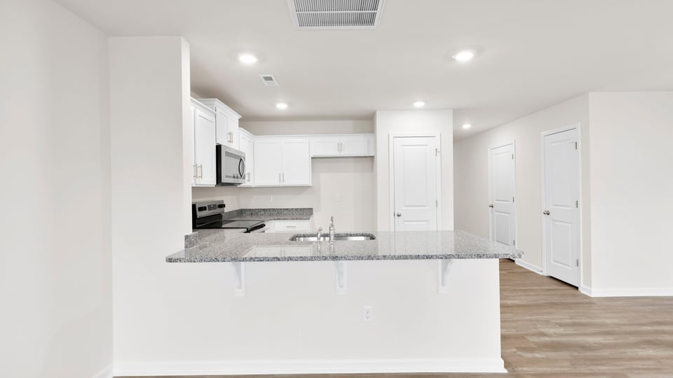Kitchen with granite countertops.