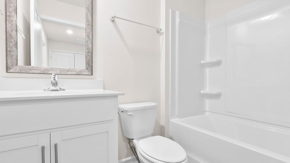 Bathroom with vanity and tub.