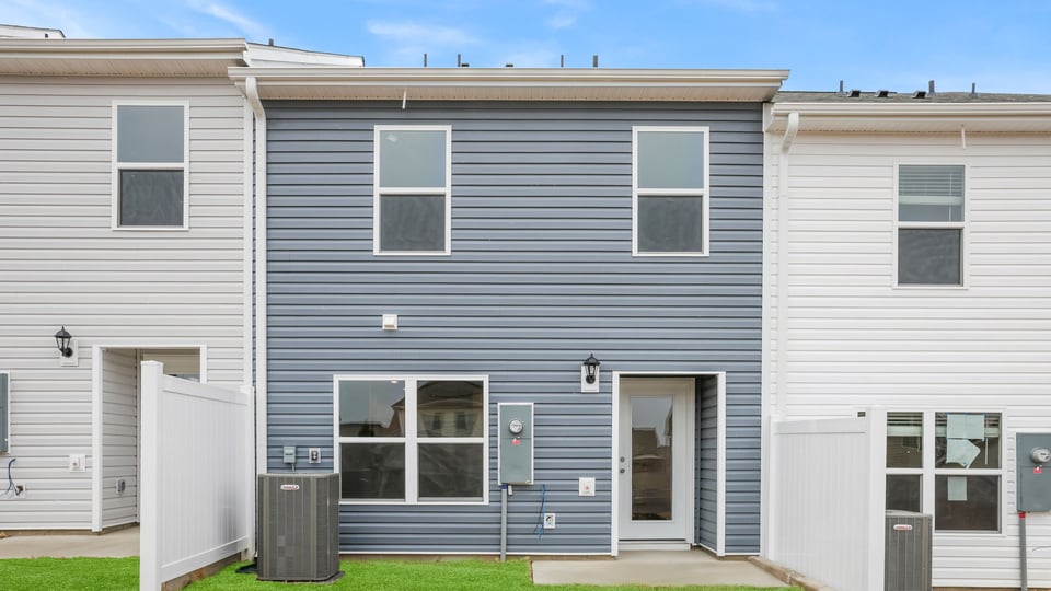 Exterior of home with backyard.