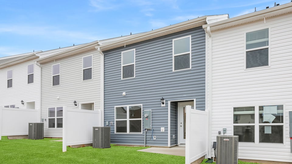 Exterior of home with backyard.