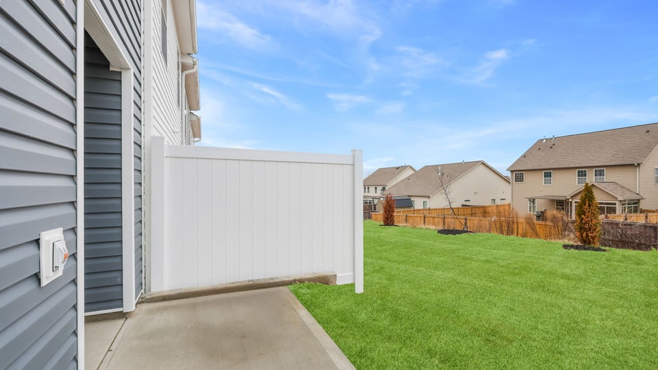 Exterior of home with backyard.