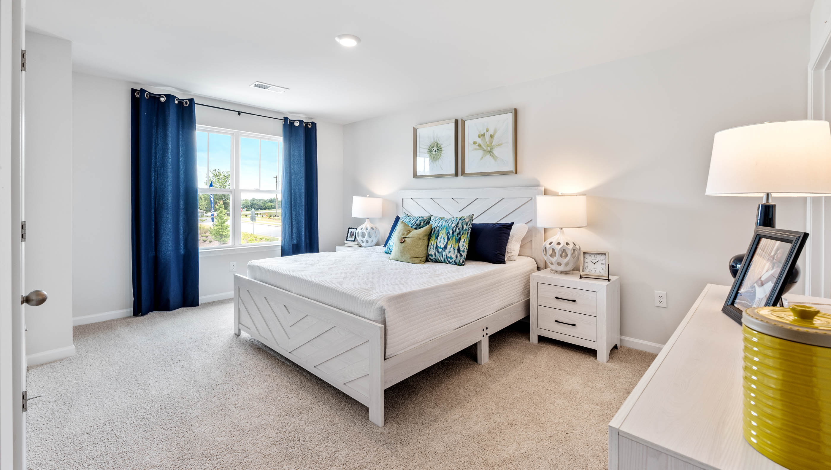 Bedroom with carpet and window.