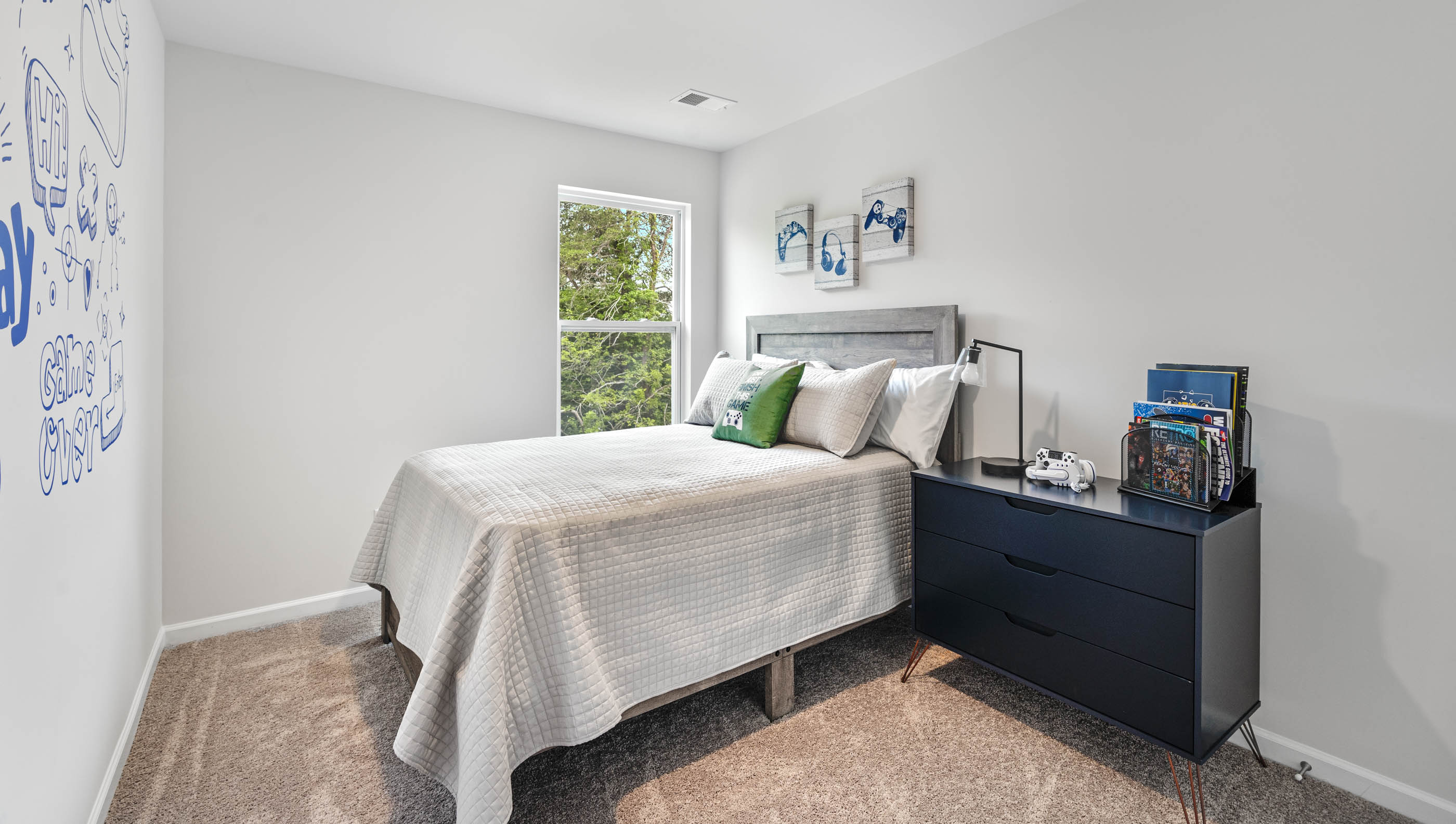 Bedroom with carpet and window.