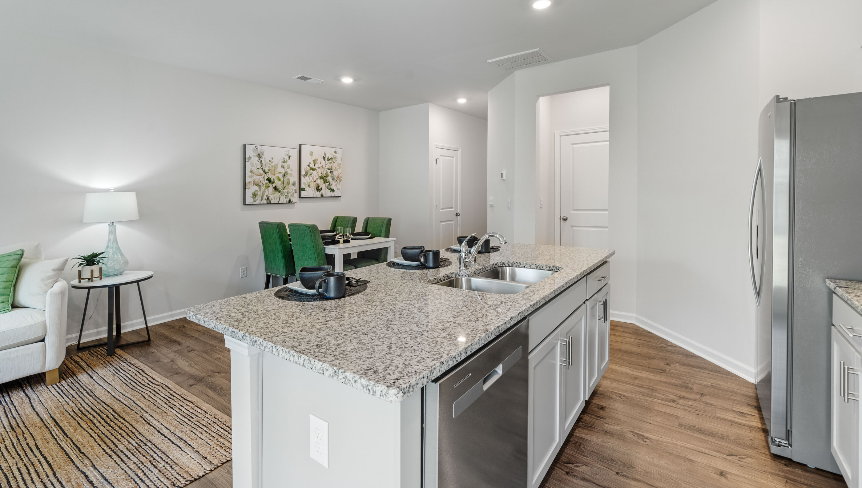 Kitchen and island with granite counter tops.