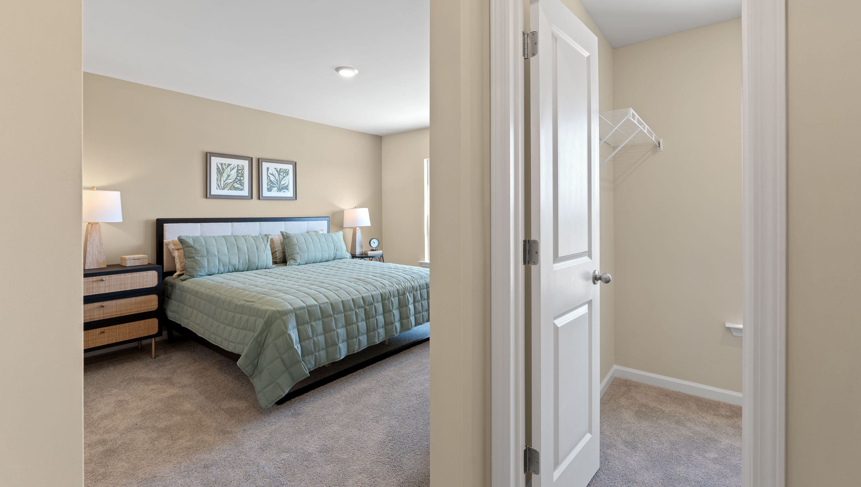 Bedroom with carpet and window.