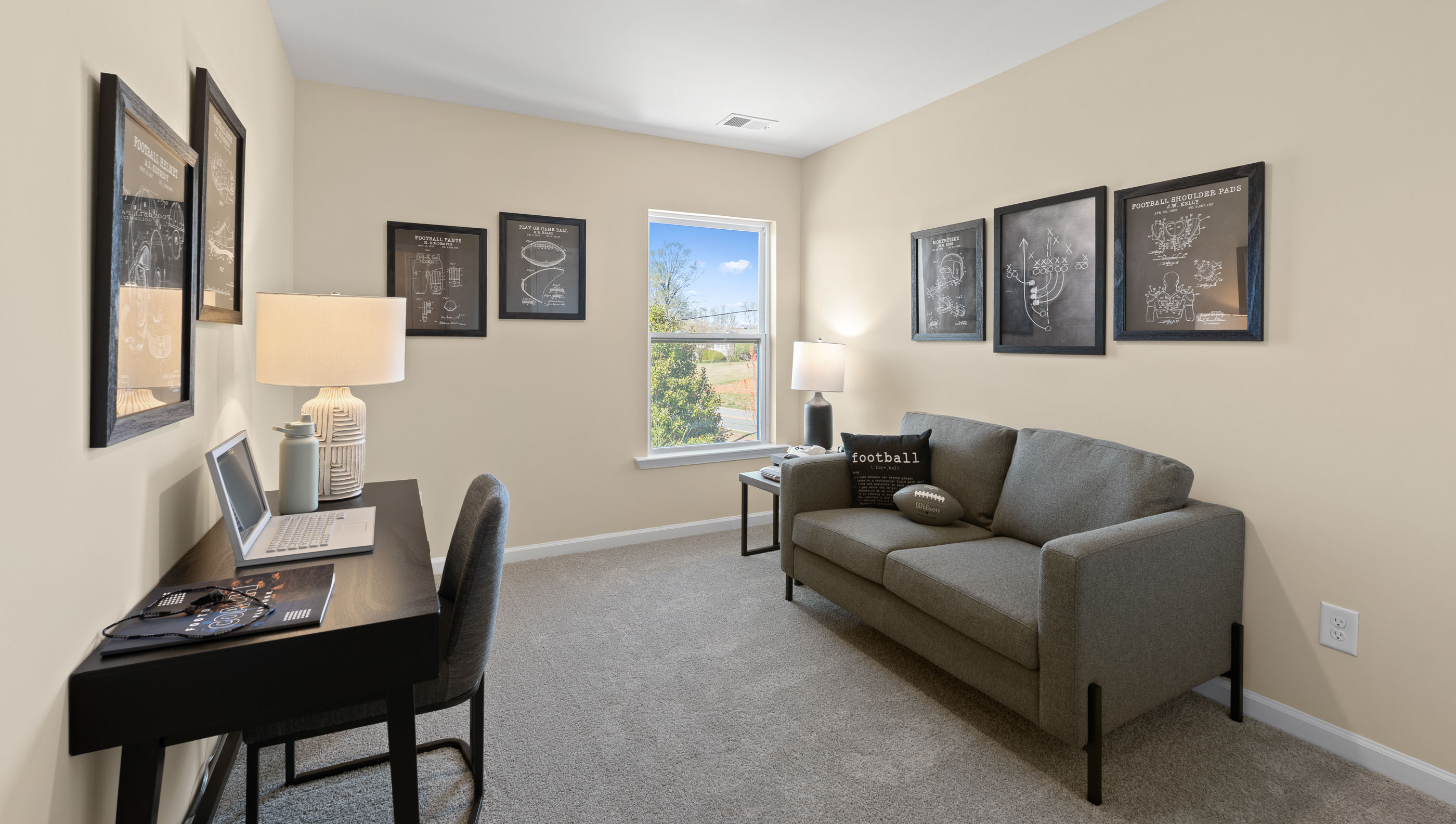 Bedroom with carpet and windows.
