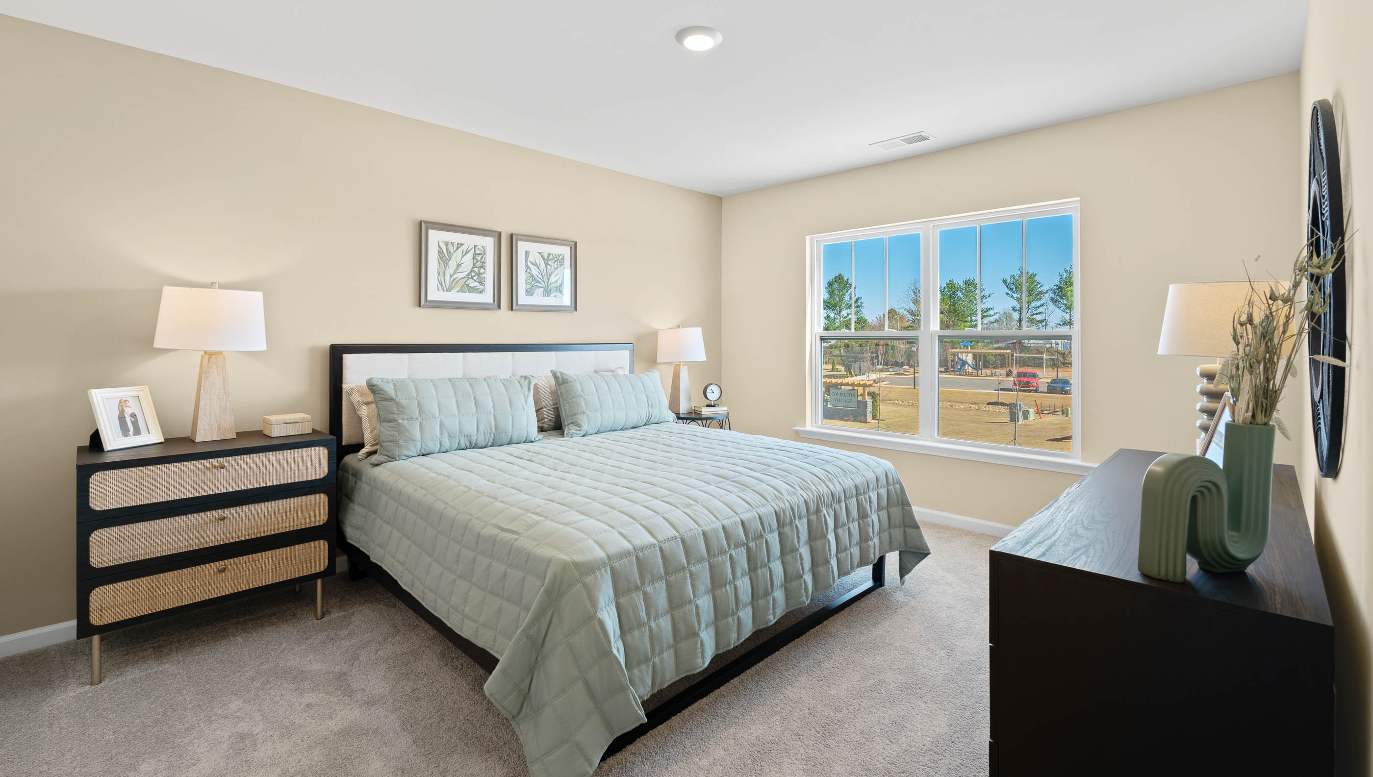 Bedroom with carpet and windows.
