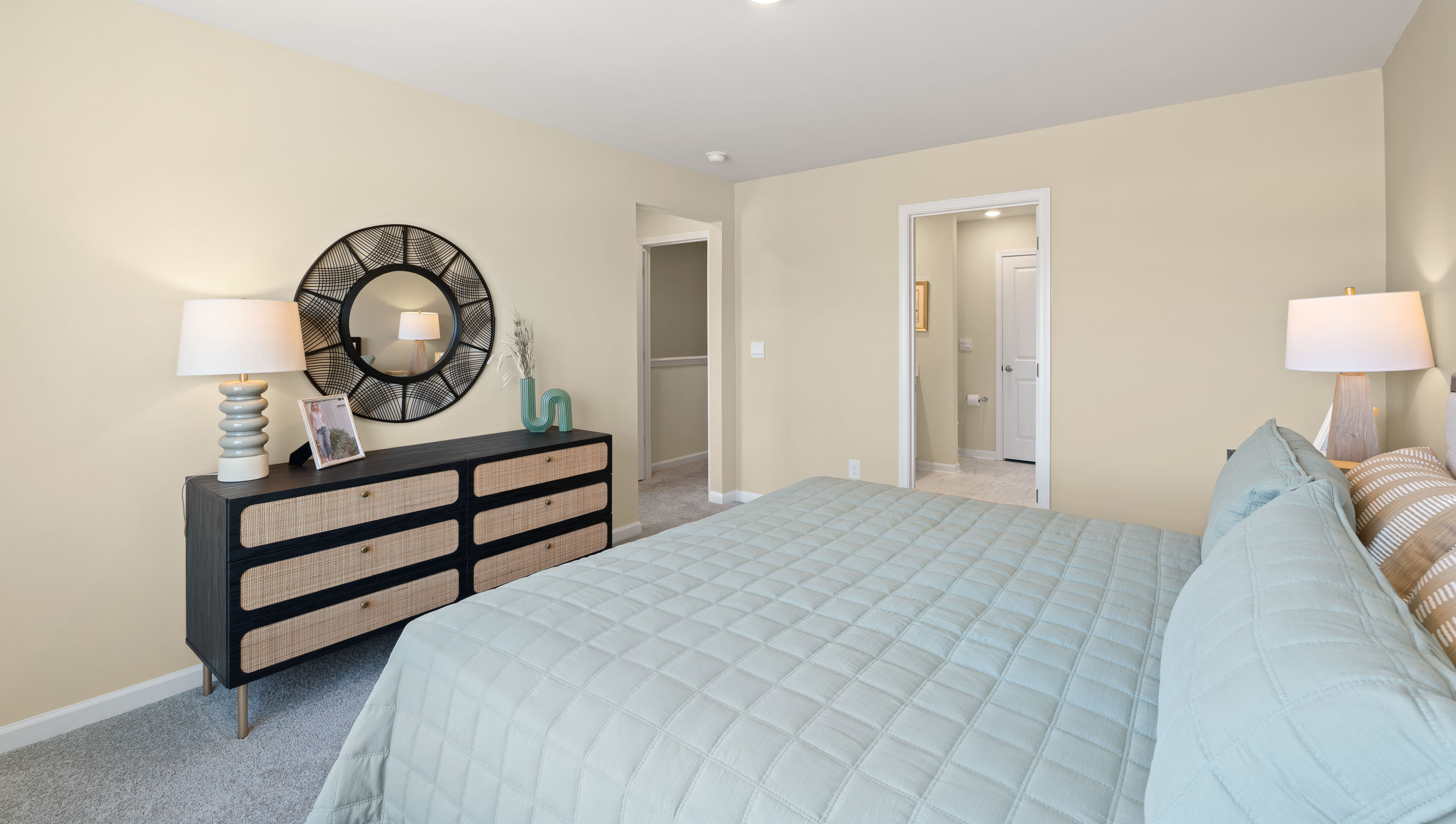 Bedroom with carpet and windows.