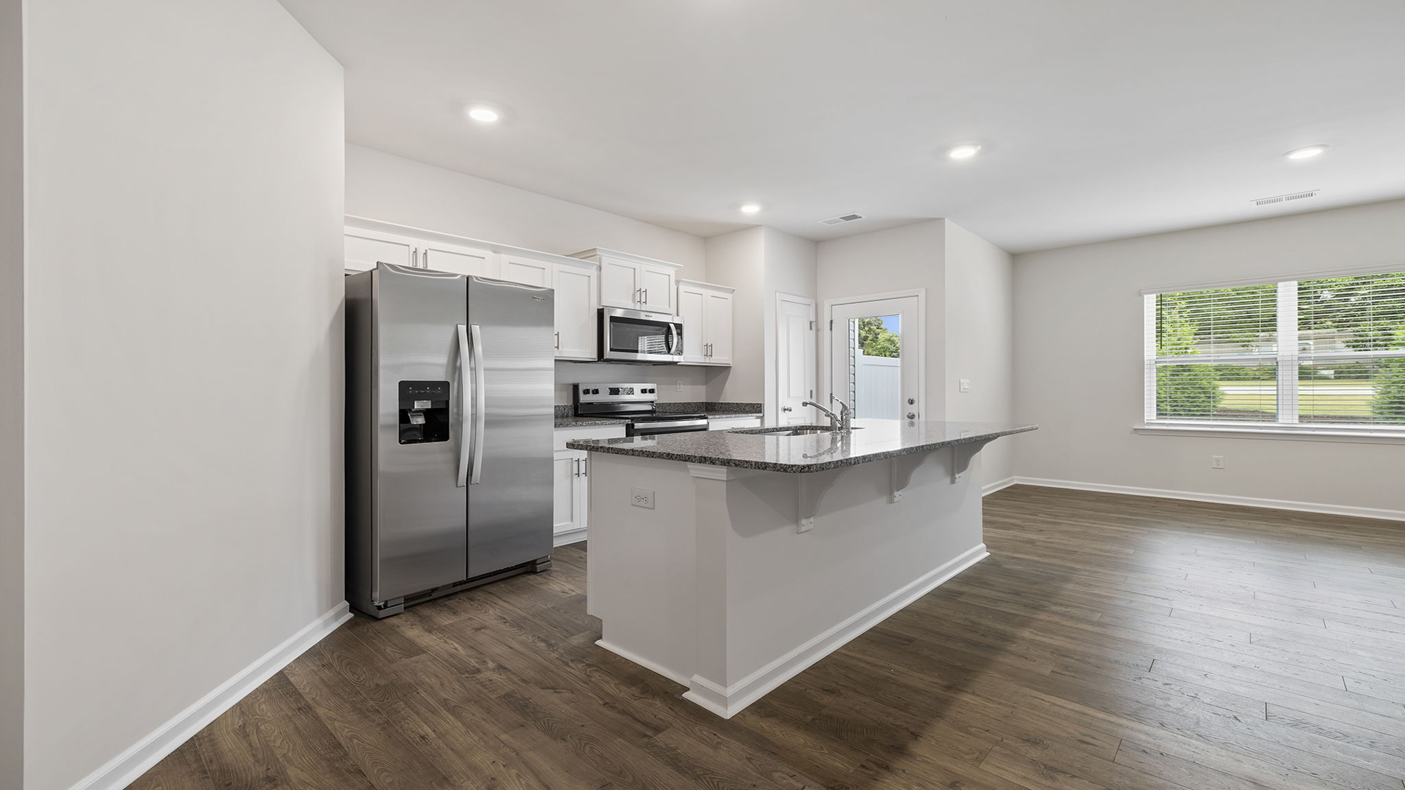 Kitchen with island and countertops.
