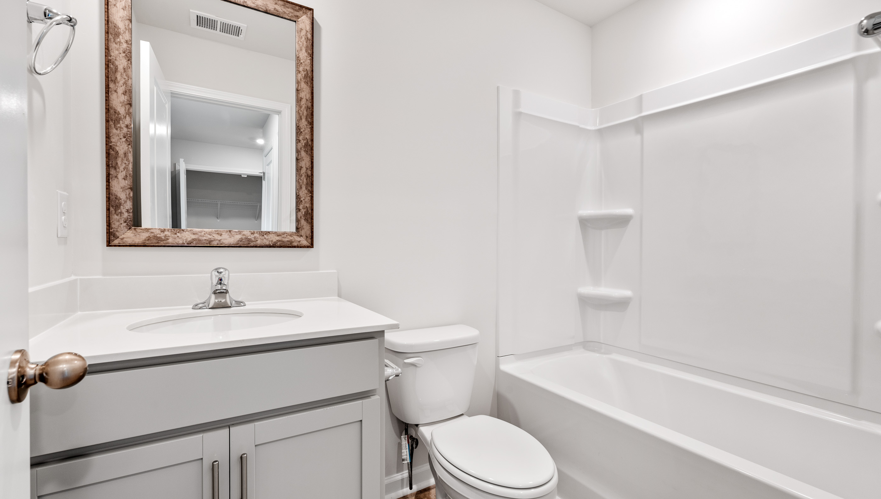 Bathroom with vanity and tub.