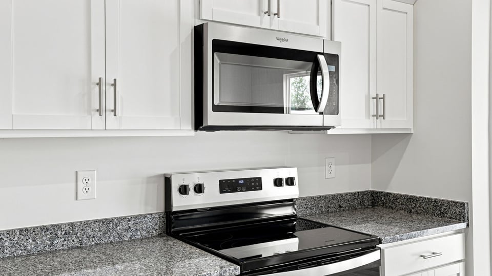 Kitchen with island and cabinets.