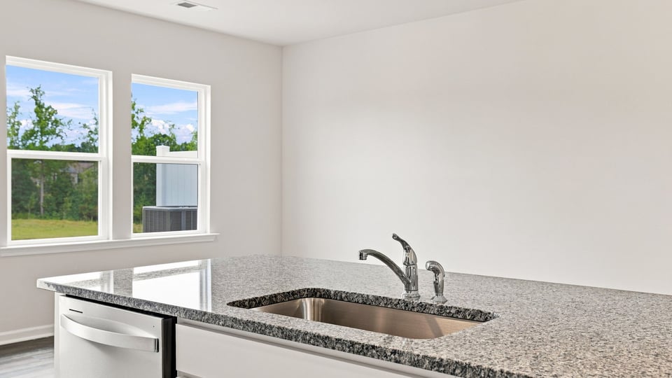 Kitchen with island and cabinets.