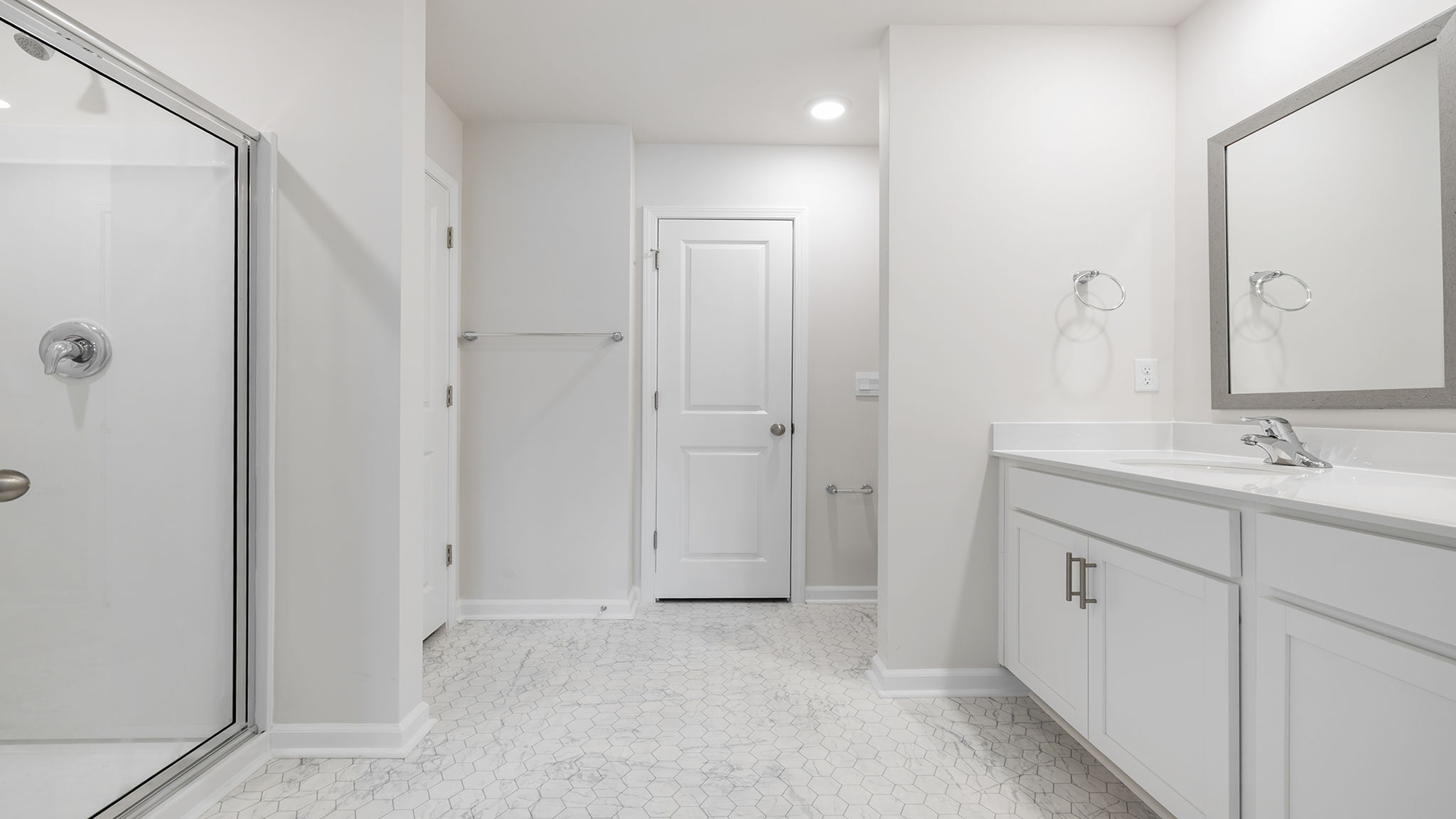 Bathroom with vanity and shower.