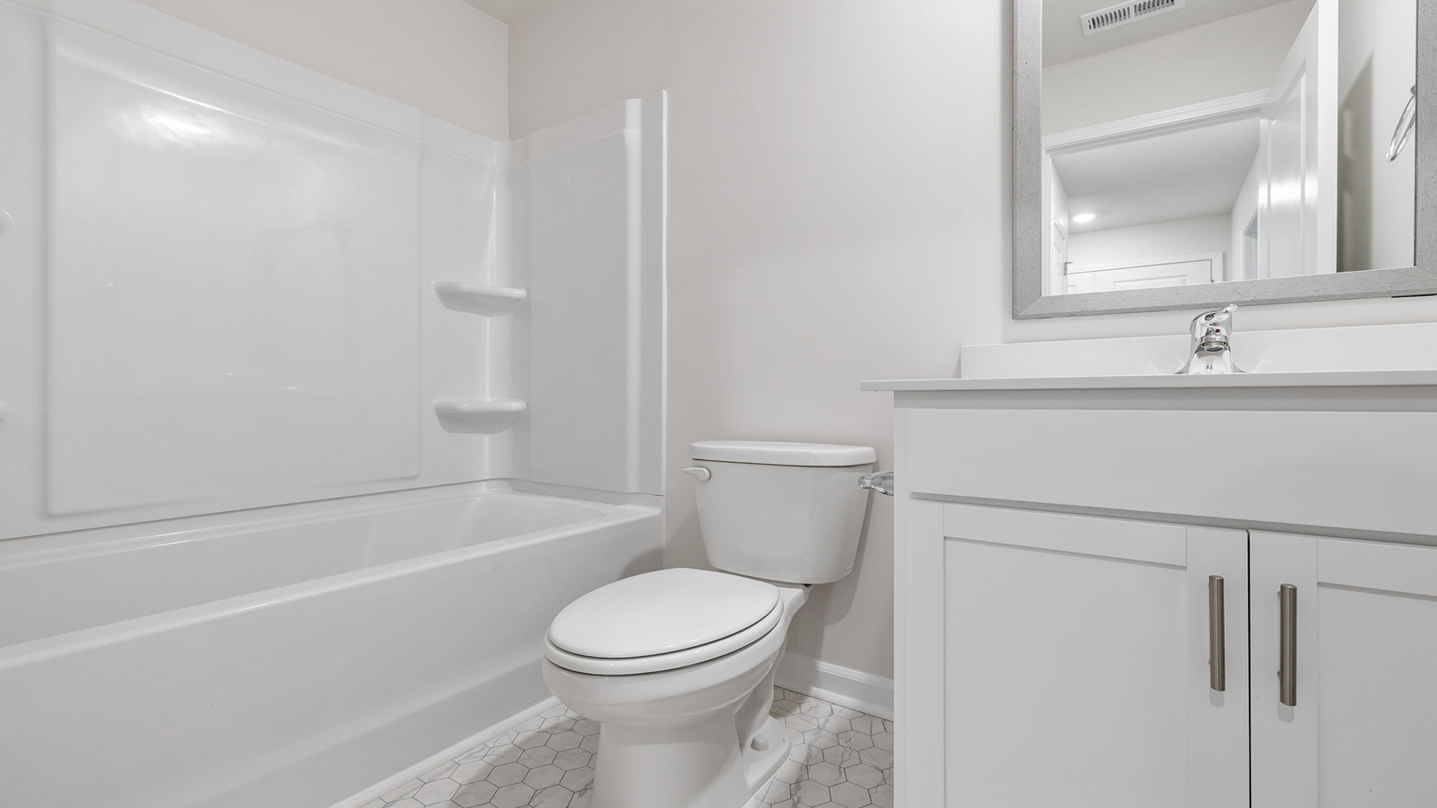 Bathroom with vanity and tub.
