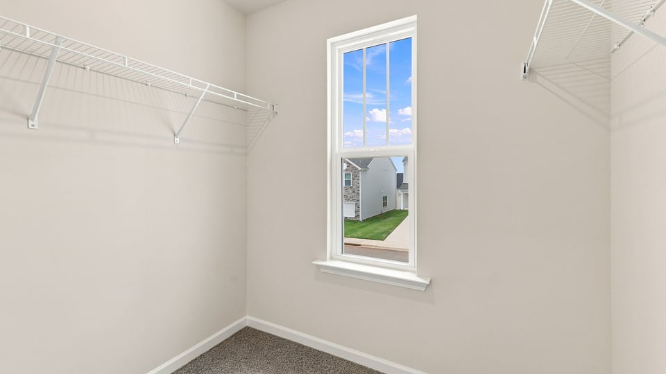 Primary closet with window.