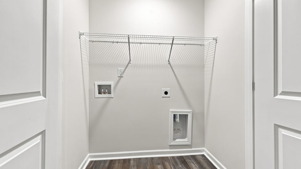 Laundry room with shelf.