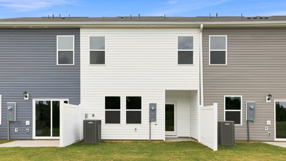 Back exterior with large backyard.
