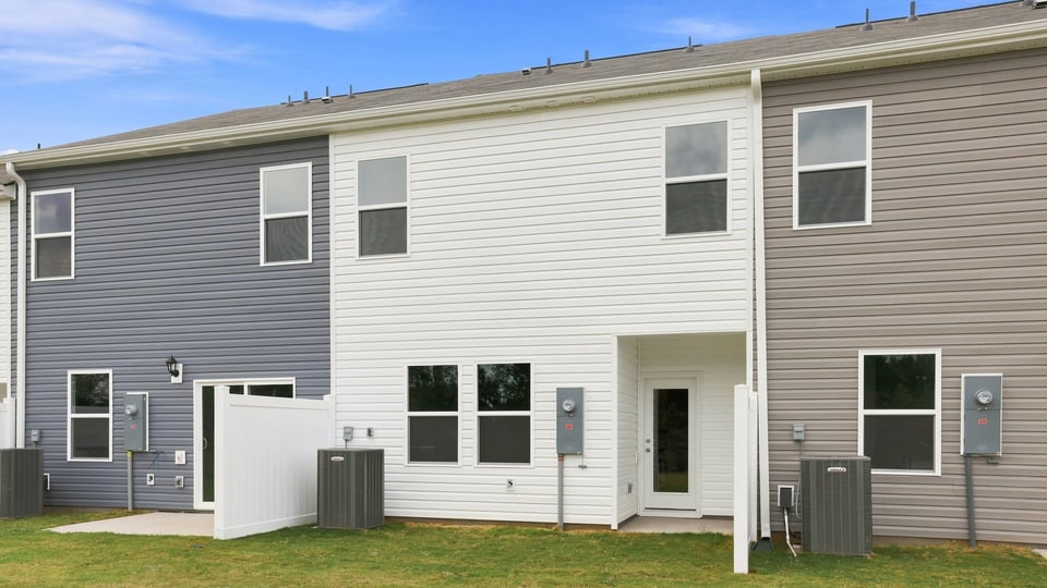 Back exterior with large backyard.