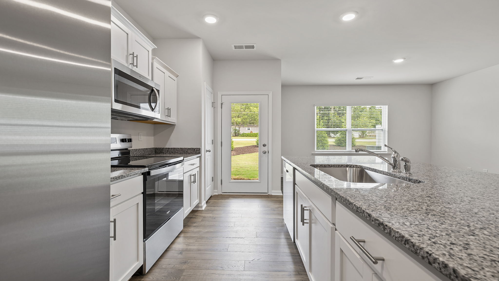 Kitchen with countertops and island.