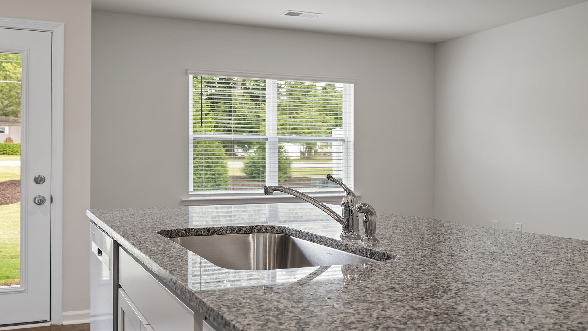 Kitchen with countertops and island.