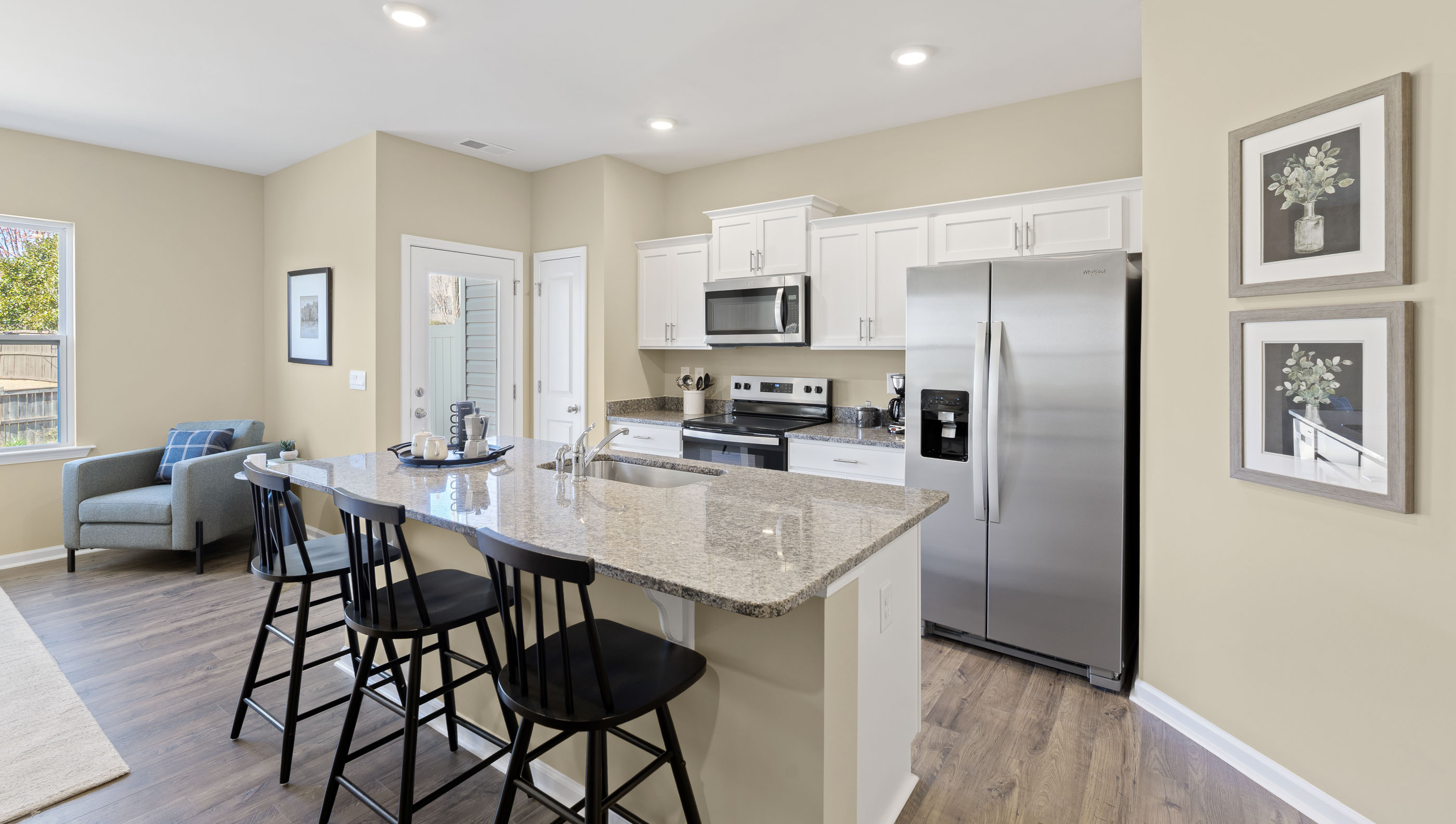 Kitchen with island and granite countertops.